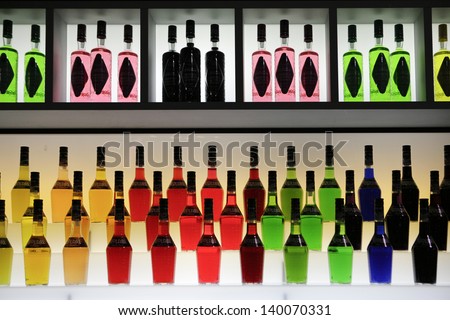 MILAN, ITALY - MAY 22: Bottles with different colors exposed in Tuttofood, Milano World Food Exhibition on May 22, 2013 in Milan, Italy