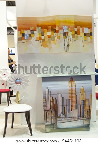 MILAN, ITALY - SEPTEMBER 12: paintings and forniture in a booth in Macef, International Home Show Exhibition on September 12, 2013 in Milan, Italy