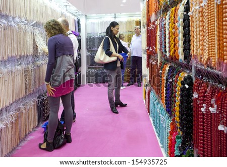 MILAN, ITALY - SEPT 12: People looking at a bijoux booth in Macef, International Home Show Exhibition on September 12, 2013 in Milan, Italy