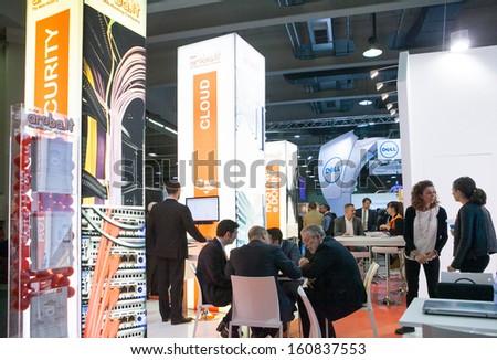 MILAN, ITALY - OCT. 25: People visiting technology booths at Smau, international fair of information and communication technology on October 25, 2013 in Milan, Italy