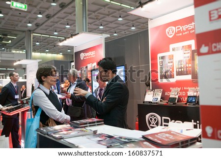 MILAN, ITALY - OCT. 25: Business men talking at Smau, international fair of information and communication technology on October 25, 2013 in Milan, Italy