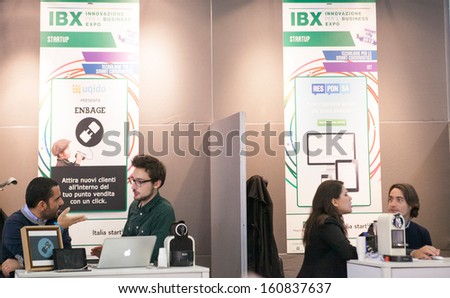 MILAN, ITALY - OCT. 25: People visiting technology booths at Smau, international fair of information and communication technology on October 25, 2013 in Milan, Italy