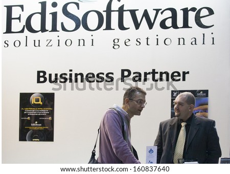 MILAN, ITALY - OCT. 25: Business men talking at Smau, international fair of information and communication technology on October 25, 2013 in Milan, Italy