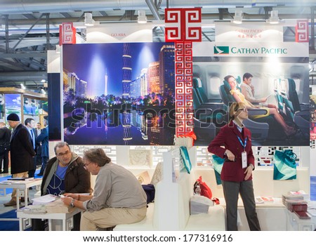 MILAN, ITALY - FEBRUARY 13: people visiting Cathay Pacific Booth at BIT, International Tourism Exchange Exhibition on February 13, 2014 in Milan, Italy