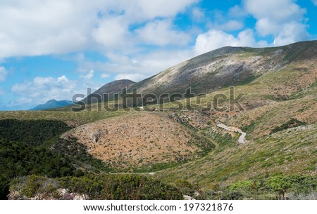 Wild landscape with road between Masua and Buggerru, west coast of Sardinia, Italy