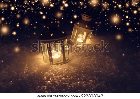 Christmas night background with lights. Lights with candles at night. Snowy xmas background.