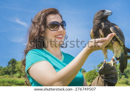 Woman with eagle on hand