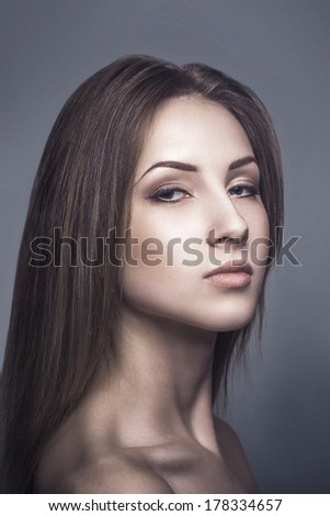 Young attractive woman fashion portrait. Close up female face. Clean skin. Glamour vogue style studio photoshoot