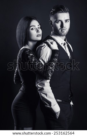 Close up black and white portrait of a loving couple. Young man and woman