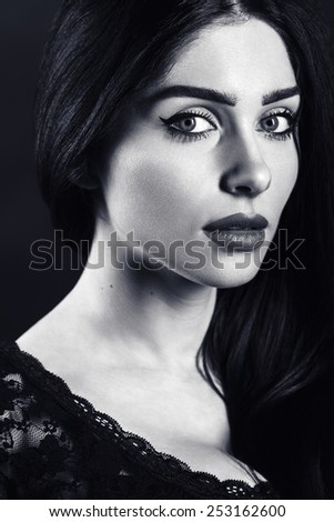 black and white portrait of a beautiful female brunette. woman close up face.