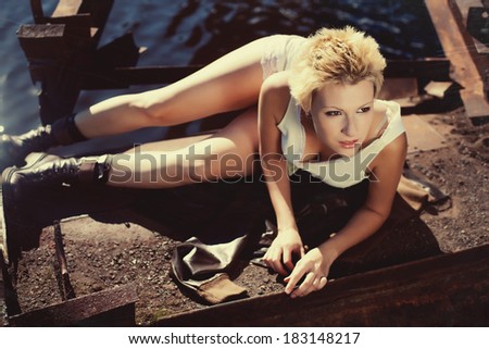 girl lying on the floor combs of rusty steel,