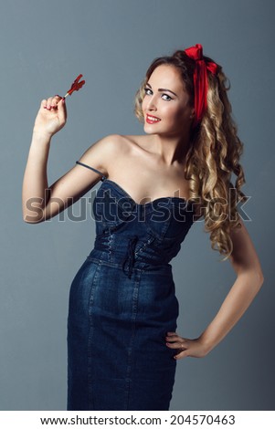 portrait sexy blonde woman in jeans sundress and red shoes pin up girl retro woman  holding a lollipop red cockerel