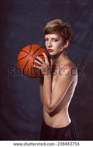 portrait of sexy girl with basketball orange bare body loves basketball slender figure, skin, victory, self-restraint, the will to win, severity, restraint