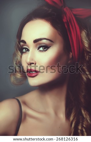 portrait sexy blonde woman pin up girl retro woman  a red capitiumon his head