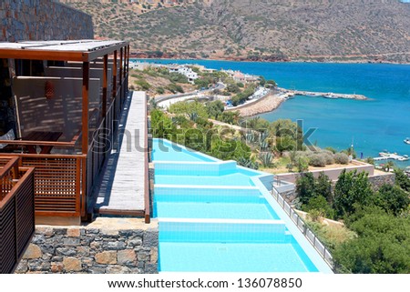 Summer sea resort with balcony and row of private swimming pools(Greece)