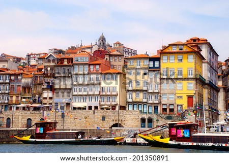 PORTO, PORTUGAL - MAY 06, 2009: View of Porto city at the riverbank (Ribeira quarter) and wine boats(\