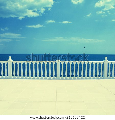 Summer view with classic white balustrade and empty terrace overlooking the sea (Italy), Instagram Effect