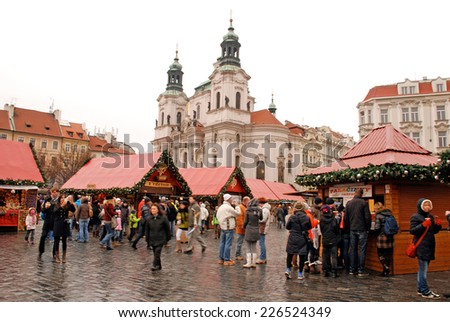 PRAGUE,CZECH REPUBLIC-DEC 29,2011: Tourists and local people on Christmas market on Old Town Square in Prague,Czech Republic.The atmosphere in Prague in December is simply wonderful!
