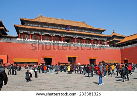 BEIJING, CHINA - MARCH 25, 2010: People visiting Tiananmen Gate to Forbidden City in Beijing, China. The Forbidden City is China\'s top tourist attraction, drawing more than 7 million visitors a year.