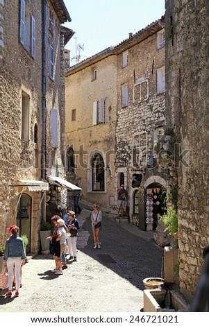 SAINT-PAUL-DE-VENCE, FRANCE - MAY 12, 2013: Beautiful narrow street with old houses in Saint Paul de Vence, one of the oldest towns of the Provence, France, famous town of painters and galleries.
