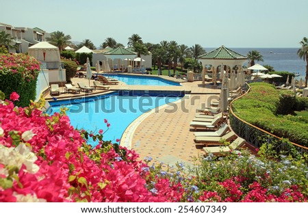 SHARM EL SHEIKH, EGYPT - MAY 03, 2014: Tropical luxury resort hotel with pool on Red Sea beach in Sharm el Sheikh, Egypt.