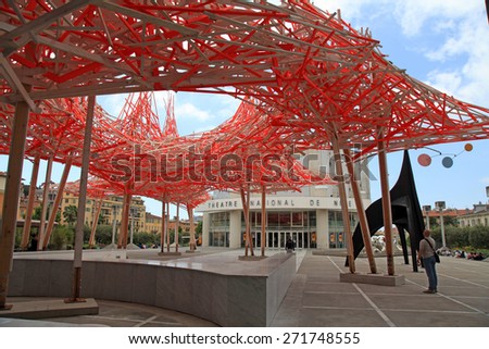 NICE, FRANCE - MAY 14, 2013: Contemporary wooden and metal art installation  and view of National Theater of Nice, France. View from Museum of Modern and Contemporary Art (MAMAC)