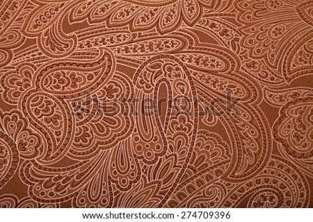 Vintage wallpaper with brown and gold paisley pattern