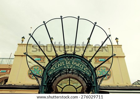MONTE CARLO, MONACO-MAY 15, 2013: The historic canopy and entrance to Cafe de Paris near the famous Monte Carlo Casino in Monaco. Vintage toned image