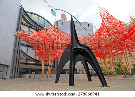 NICE, FRANCE - MAY 14, 2013: Wooden and metal art installation and facade of Museum of Modern and Contemporary Art (MAMAC), major cultural and touristic landmark in Nice, France.