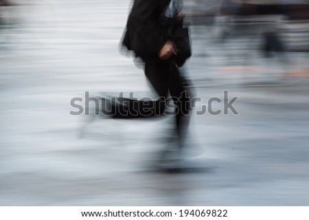 The motion blur of walking man in city.