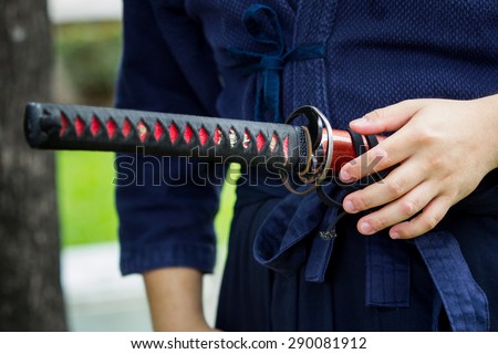 The treaditional Japanese sword (Katana sword) holding in Samurai hand prepare to flighting.