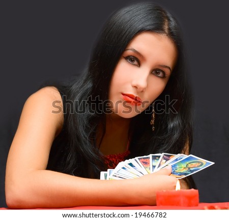 Portrait girl with cards on black background