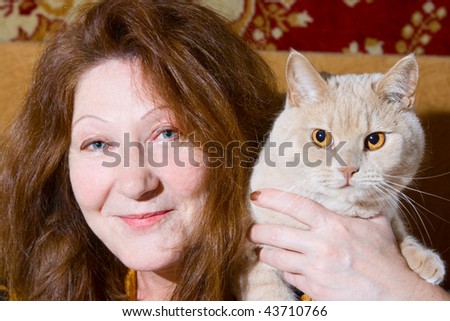 Portrait old woman and cat