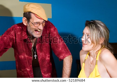 Angry Man in cap and afraid girl in swimsuite