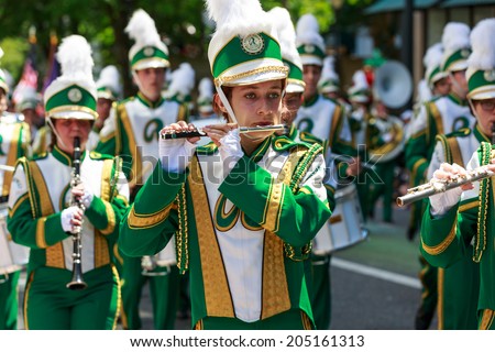 Portland, Oregon, USA - JUNE 7, 2014: Roosevelt High School Marching Band in Grand floral parade through Portland downtown.