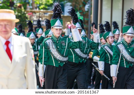 Portland, Oregon, USA - JUNE 7, 2014: West Salem High School Marching Band in Grand floral parade through Portland downtown.