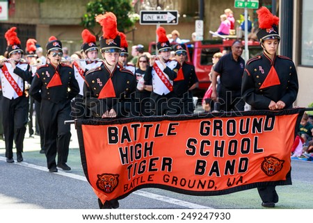 Portland, Oregon, USA - JUNE 7, 2014: Battle Ground High School Marching Band in Grand floral parade through Portland downtown.