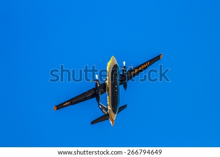Hillsboro, Oregon - September 20, 2014: The C-31A Troopship of the US Army Golden Knights Parachute Team flies above at the Oregon International Air Show.