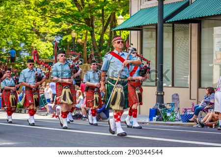 Portland, Oregon, USA - June 6, 2015: Clan Macleay Pipe Band in the Grand Floral Parade during Portland Rose Festival 2015.