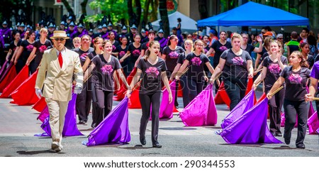 Portland, Oregon, USA - June 6, 2015: Sunset High School Marching Band in the Grand Floral Parade during Portland Rose Festival 2015.