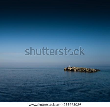 Small rocky island in ocean
