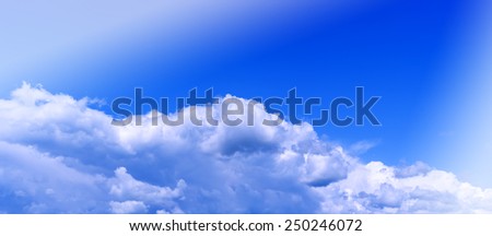 Horizontal vivid wide pano bottom aligned cloudscape compostion with light background backdrop