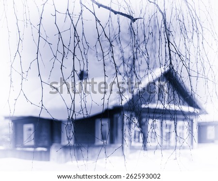 Horizontal pale blue sepia Russian traditional house tree branches framing background backdrop