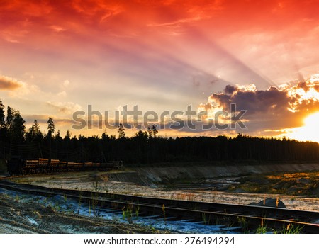Horizontal red vivid sunset on vintage railroad track landscape background backdrop