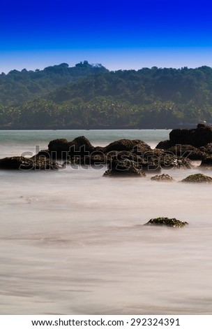 Vertical vivid ocean stones horizon landscape background backdrop