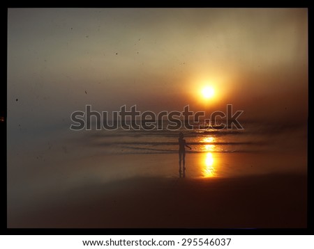 Horizontal vintage indian boy meeting sunset on the beach postcard background backdrop