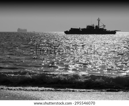 Horizontal black and white ship silhouette with tidal waves background backdrop