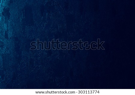 Horizontal dark blue textured wall with light background