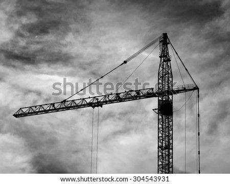 Horizontal black and white industrial construction crane background