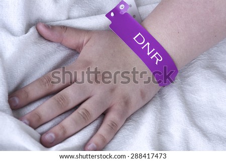 Do not resuscitate purple bracelet on a female patient in the hospital